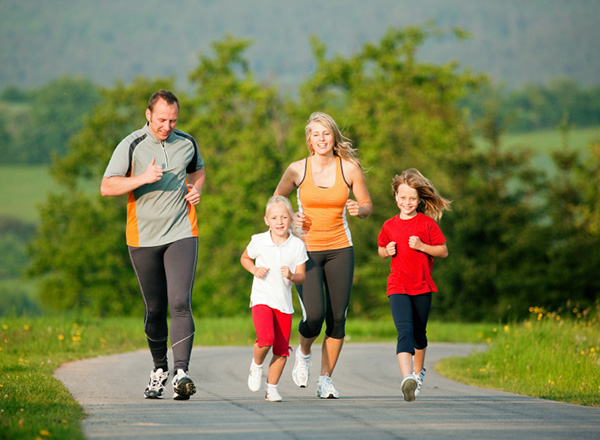 Family exercising together by running.