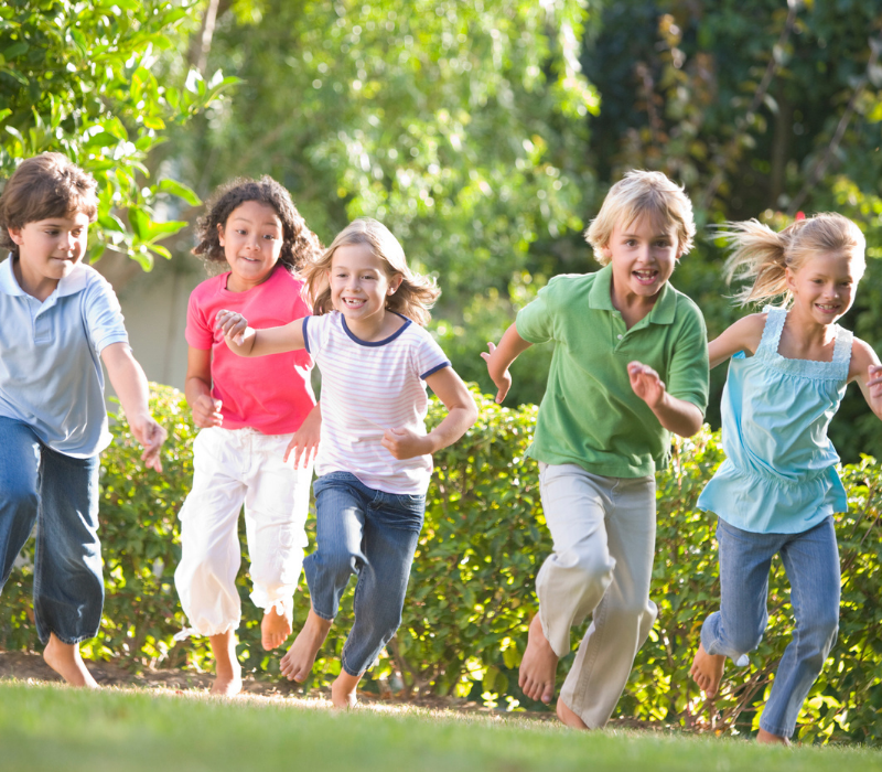 Active kids running as a group.