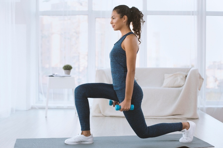 Woman exercising with a dumbbell.