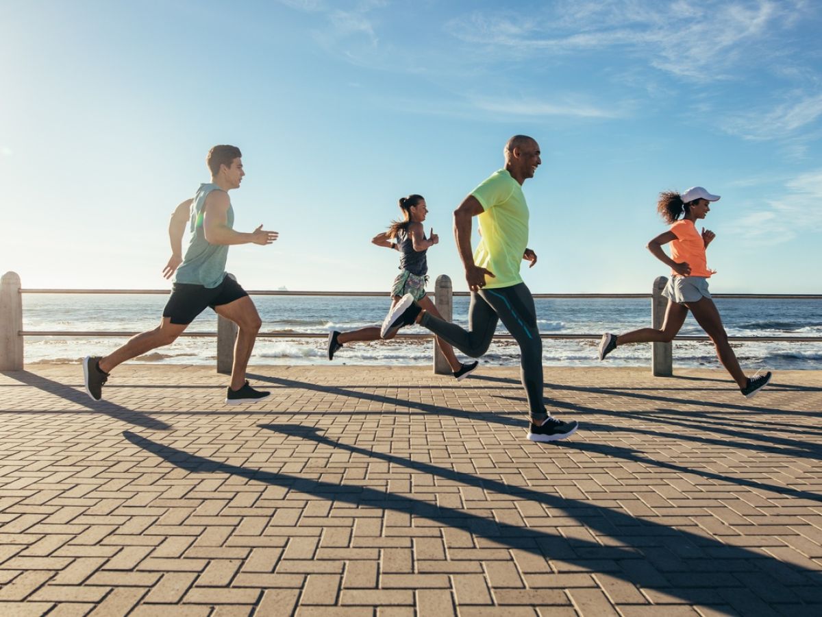 Group of people exercising by running.