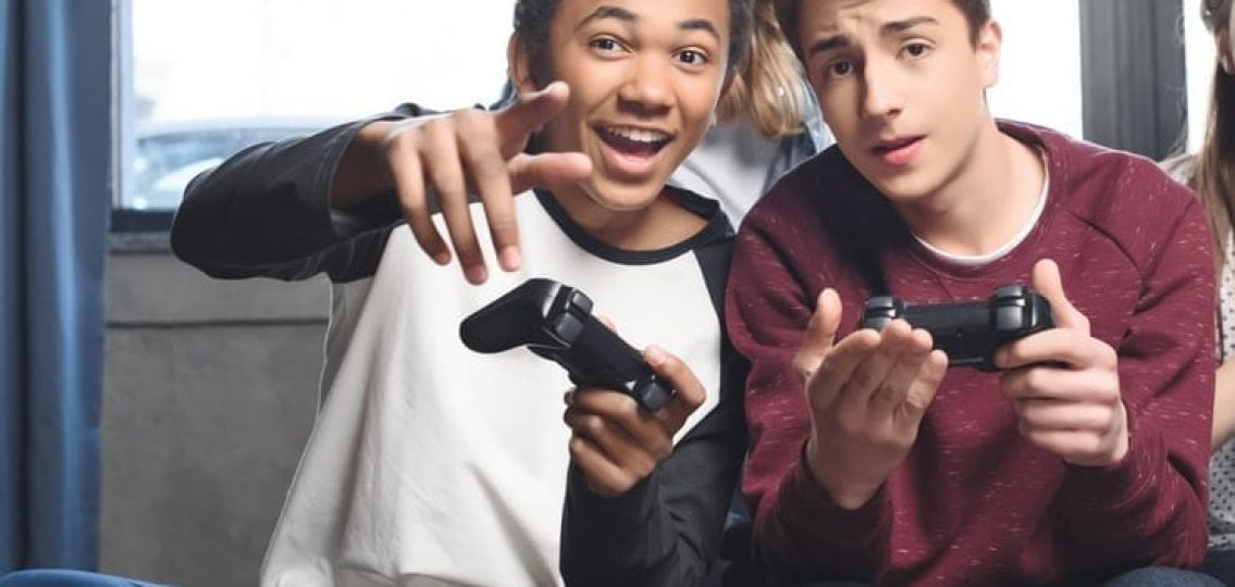 Teens playing video games.