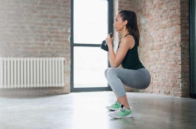 Woman exercising at home.