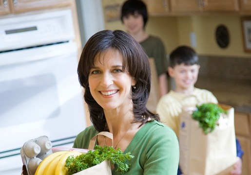 Woman choosing food for her family.