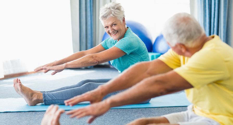 Seniors exercising on the floor