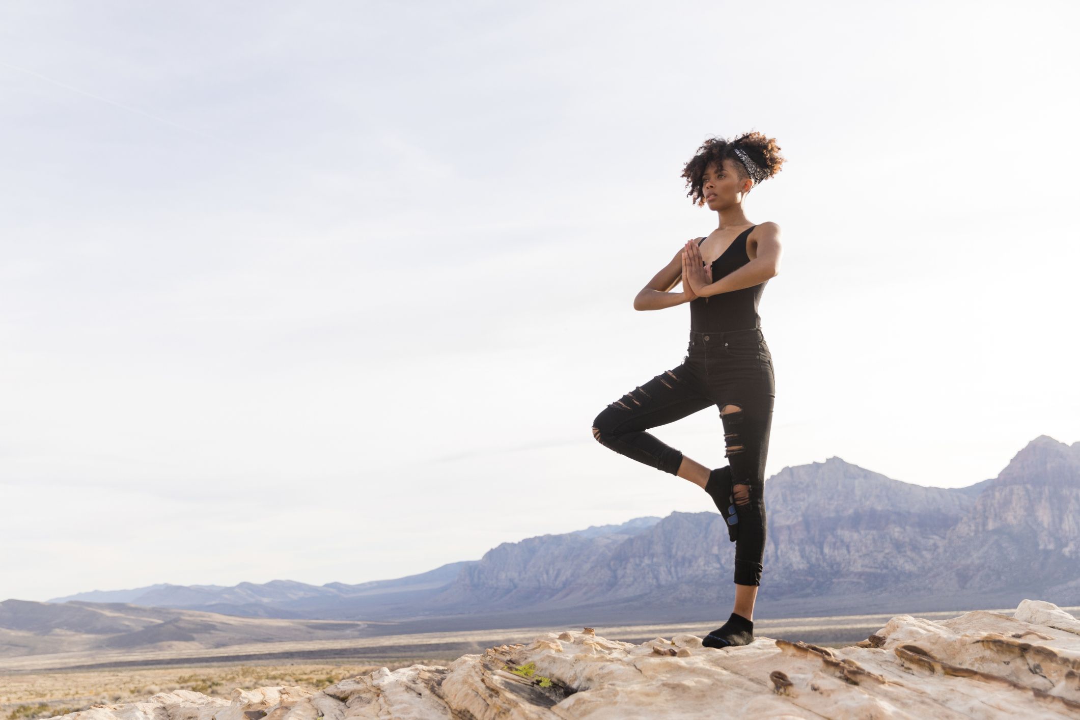 Woman standing on one foot