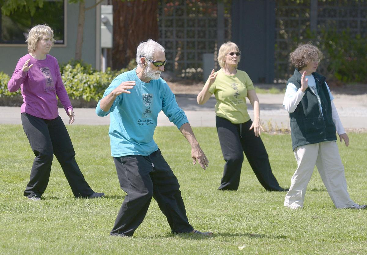 Group of people demonstrating tai chi walking